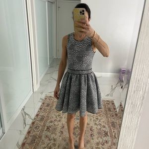 An elegant black-and-white lace dress